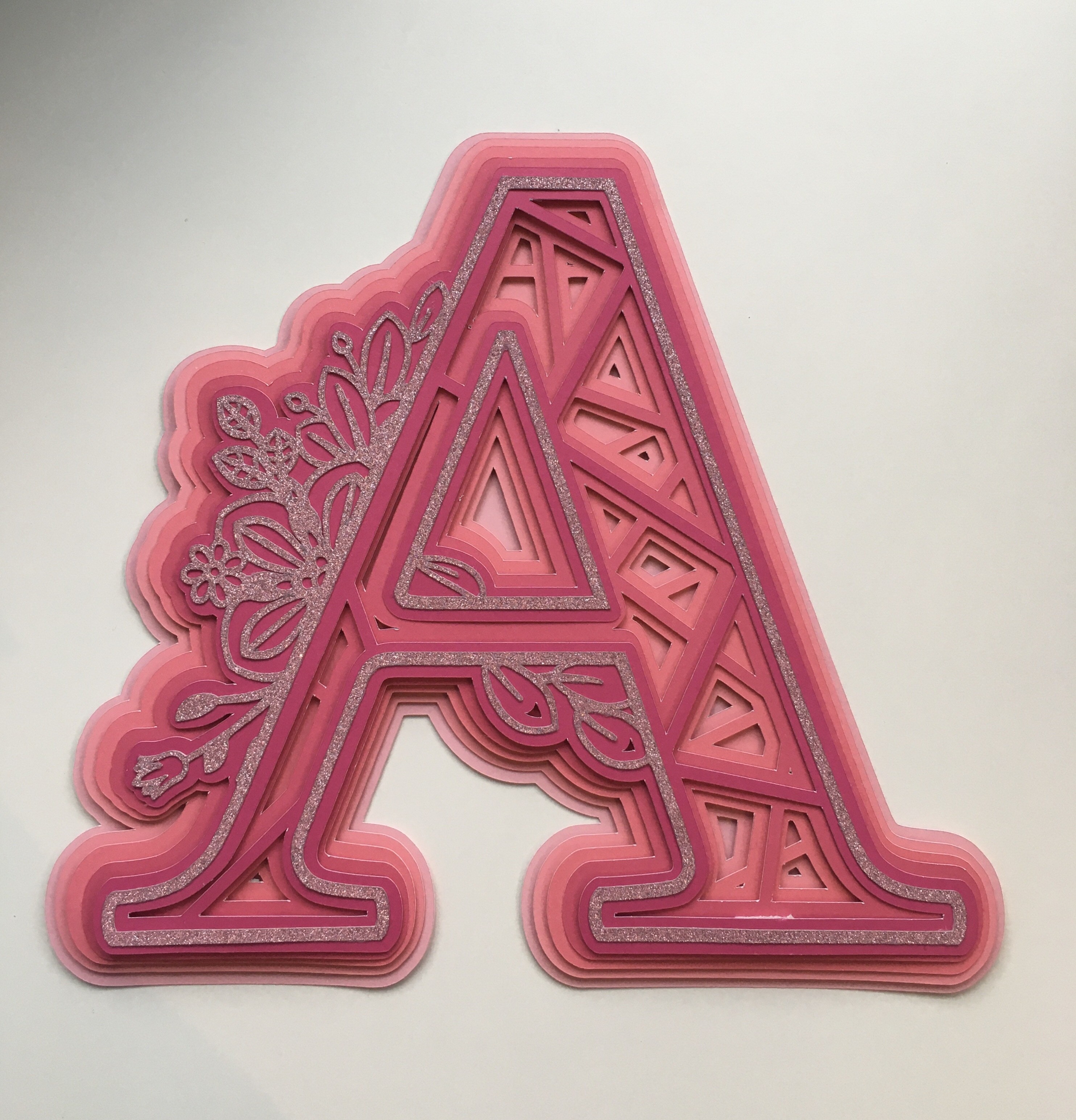Pink letter A mandala design